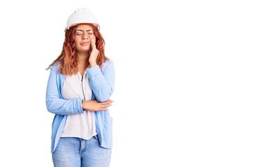 Young latin woman wearing architect hardhat touching mouth with hand with painful expression because of toothache or dental illness on teeth. dentist