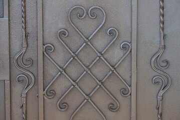 gray brown metal texture of iron wall and twigs in a pattern