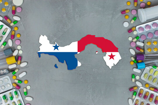 The Panama State began research for treatment and medicine to combat the pandemic outbreak disease coronavirus. Medicine, pills, needles, syringes and Panama map and flag on gray background.