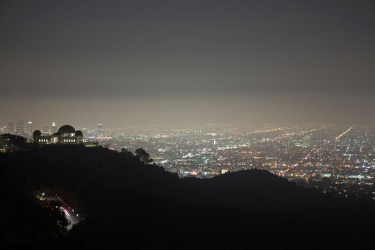 Night fog settling into the hills above Griffith Park in Los Angeles, California.