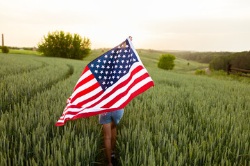 Independence day concept with woman holding american flag