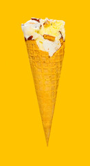 side view vanilla flaovr ice cream cone with some bites on a yellow background