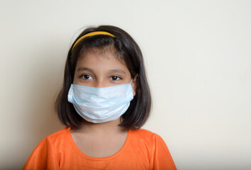 asian kid with wearing  mask due to covid 19 pandemic