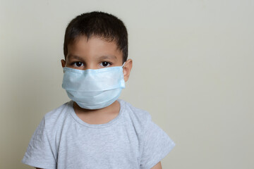 asian kid with wearing mask  due to corona virus