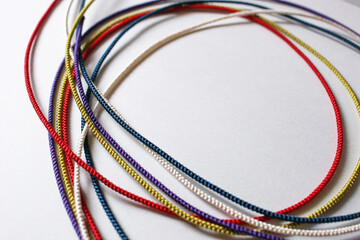 Five colors strings on white background