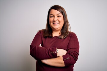 Beautiful brunette plus size woman wearing casual sweater over isolated white background happy face smiling with crossed arms looking at the camera. Positive person.