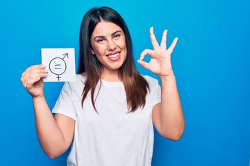 Young beautiful woman asking for sex discrimination holding paper with gender equality concept...