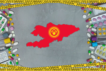 Kyrgyzstan is struggling with an epidemic coronavirus pandemic. Kyrgyzstan quarantine measures and coronavirus. Medicine, drugs, needles, syringes and Kyrgyzstan map and flag over gray background.