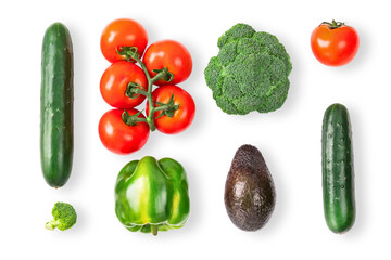 Vegetable creative layout on white background. Tomatoes branch, orange bell pepper, avocado, cucumber, broccoli. Vegetarian healthy food concept.