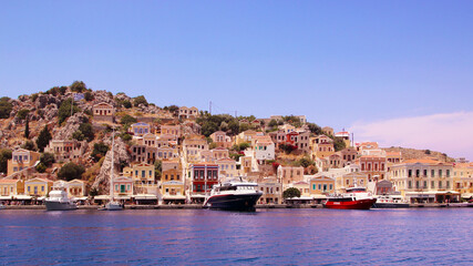 Symi town, Symi island, pictorial view of colorful houses and  Yialos harbour