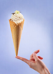 Ice cream with a woman's hand