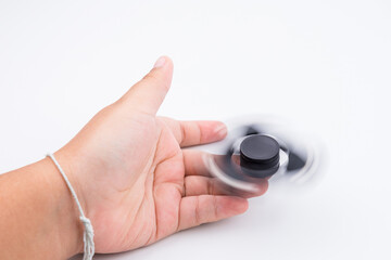 Fototapeta premium Women hand holding popular fidget spinner toy.