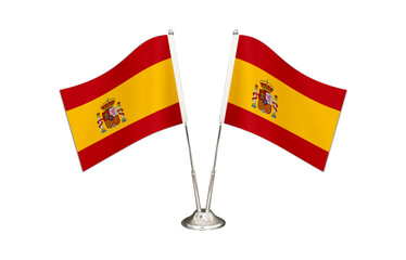 Spain table flag isolated on white ground. Two flag poles with flags and Spain flag on the table.