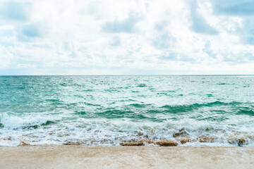 Tropical nature clean beach and white sand in summer with sun light blue sky and bokeh background.