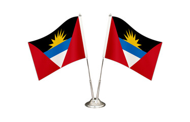Antigua and Barbuda table flag isolated on white ground. Two flag poles with flags and Antigua and Barbuda flag on the table.