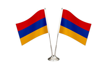 Armenia table flag isolated on white ground. Two flag poles with flags and Armenia flag on the table.