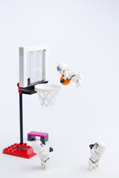 Nonthaburi, Thailand - November, 19, 2016: Lego star wars stormtrooper playing basketball at basketball court.Sports background.Lego is an interlocking brick system collected around the world.