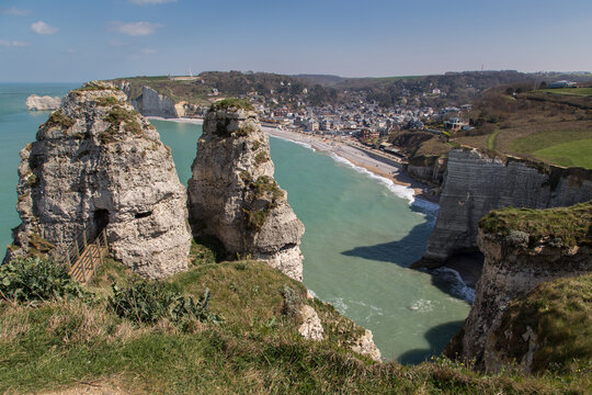 Panoramic view on Etretat town, Normandy, France from chalk cliff on sunny day