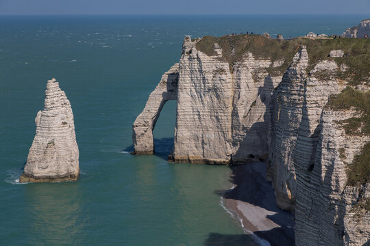Porte d'Aval, chalk arched cliff, and L'Aigulle, The Needle cliff, in Etretat, Normandy, France