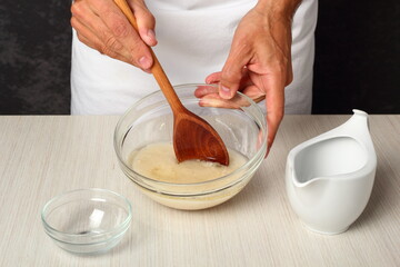 Making leaven - mixing fresh yeast, water and oil. Making Flatbread.