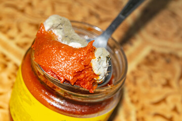 Mold growing on the tomato paste. Close up.