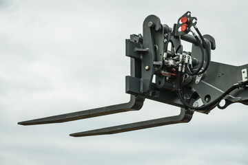 Forklift industrial loader or stacker against sky.