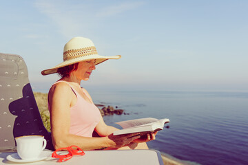 Woman on sea read book, relaxing