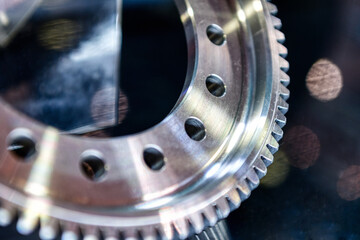 Fragment of a gear wheel closeup shot.