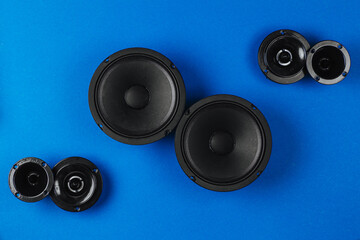 Car audio, car speakers, black subwoofer on a blue background