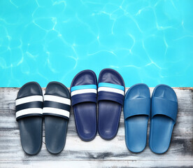 Flip-flops on the edge of swimming pool