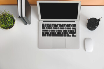 Modern laptop at workplace, top view