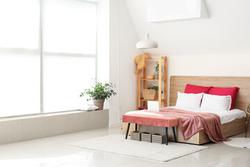 Big bed and bench in interior of modern room