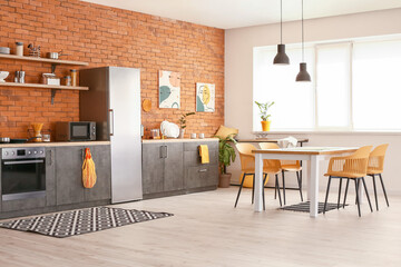 Stylish interior of modern kitchen with dining table