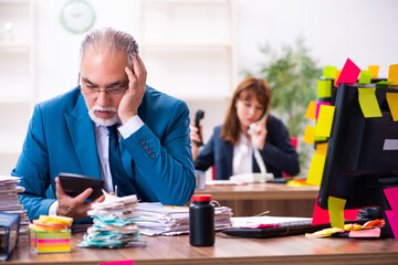 Two employees and excessive work in the office