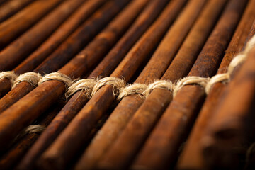 A closeup view of a foreign wicker wooden stick surface, as a background image.