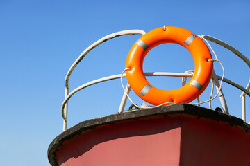 Boat with lifebuoy ring on berth