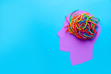 Paper human head and laces on color background. Neurology concept