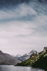 Mountain and lake landscape with clouds