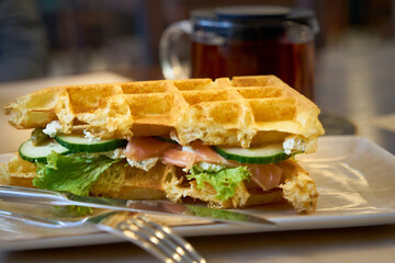 Brussels waffles with smoked salmon and salad.