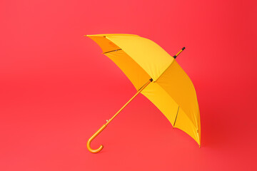 Stylish umbrella on color background