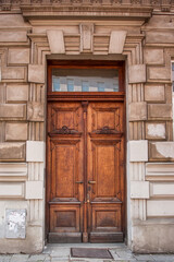 Fototapeta na wymiar Front door with small square decorative window