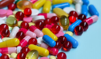 Multi-colored tablets, capsules, vitamins, supplements. Сoncept of treatment and healthcare. Flat lay.