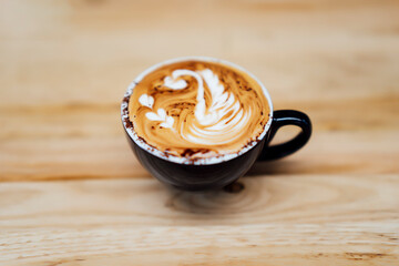 swan figure in coffee foam