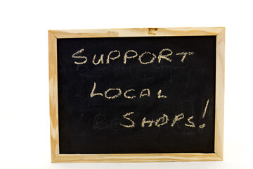 Small blackboard with a message to support small local business during the lockdown for covid-19 isolated on a clear background with copy space