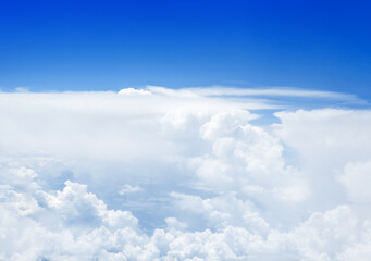 White cumulus clouds on clear blue sky background, aerial cloudscape panoramic view from airplane, high azure skies panorama, fluffy cloud backdrop, sunny heaven, cloudy flight landscape, copy space