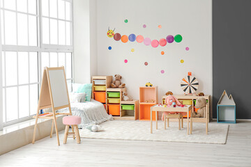 Stylish interior of modern playroom in kindergarten - obrazy, fototapety, plakaty
