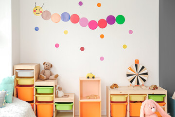 Stylish interior of modern playroom in kindergarten