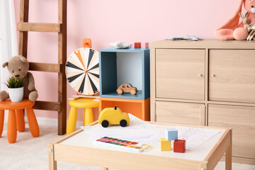 Stylish interior of modern playroom in kindergarten