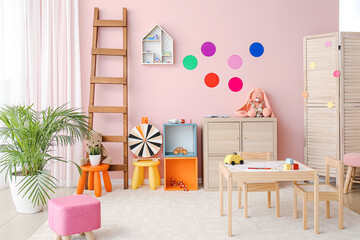 Stylish interior of modern playroom in kindergarten