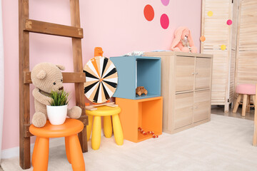 Stylish interior of modern playroom in kindergarten